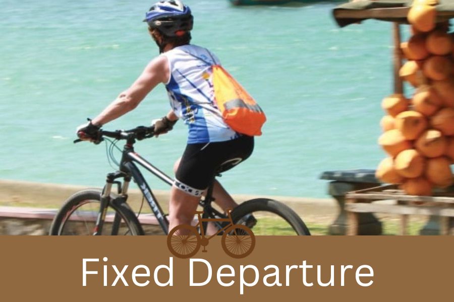 a man cycling at coastal area in Sri Lanka 