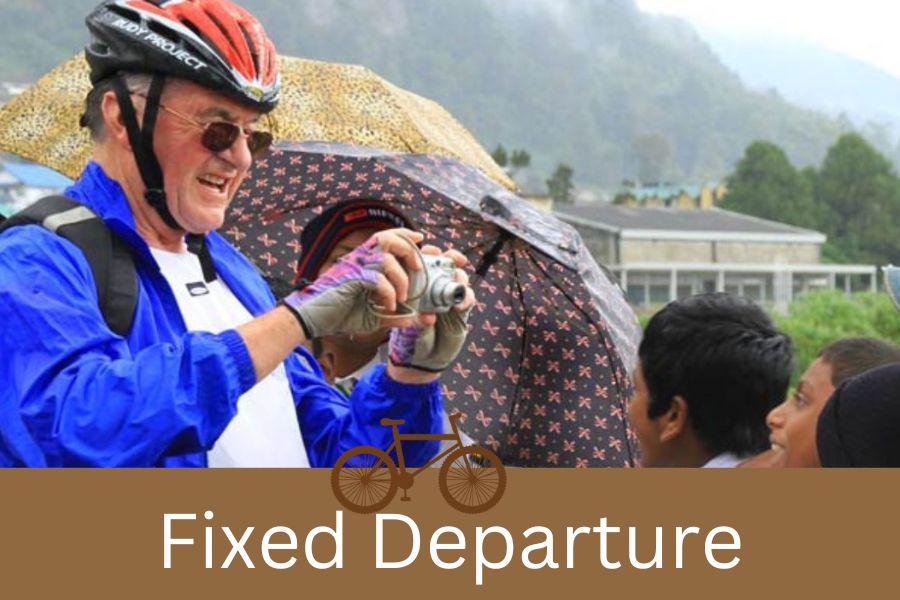 a tourist taking a picture of a group of children