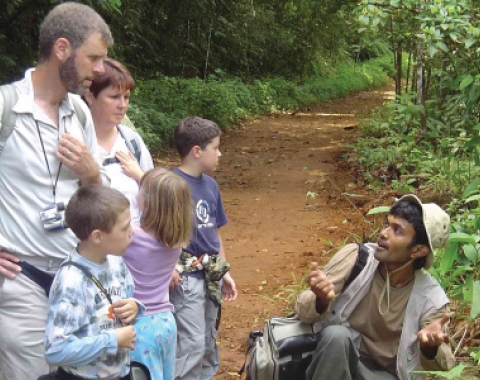 A tourist family exploring the nature with their guide 