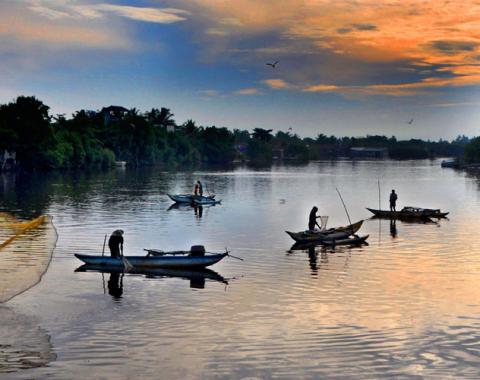 fishing boats on a river